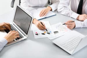 Business professionals reviewing work together